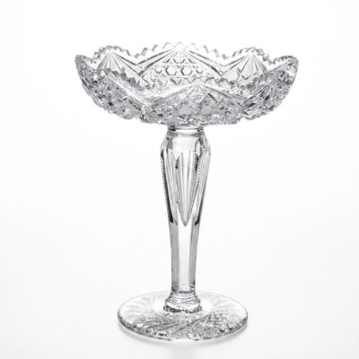 American Brilliant Period cut-crystal compote circa 1880–1905 with fan, strawberry diamond, starburst and zipper cuts, sawtooth rim, faceted stem, and star-cut foot, 11½ inches high