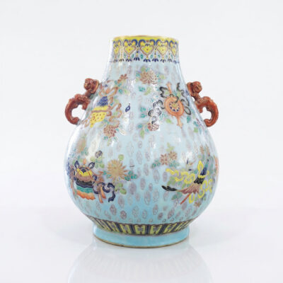 Chinese Famille Rose Porcelain Vase in hu form with celadon blue ground, Buddhist emblems, iron-red foo dog handles and yellow neck border from the Ann and Gordon Getty Collection