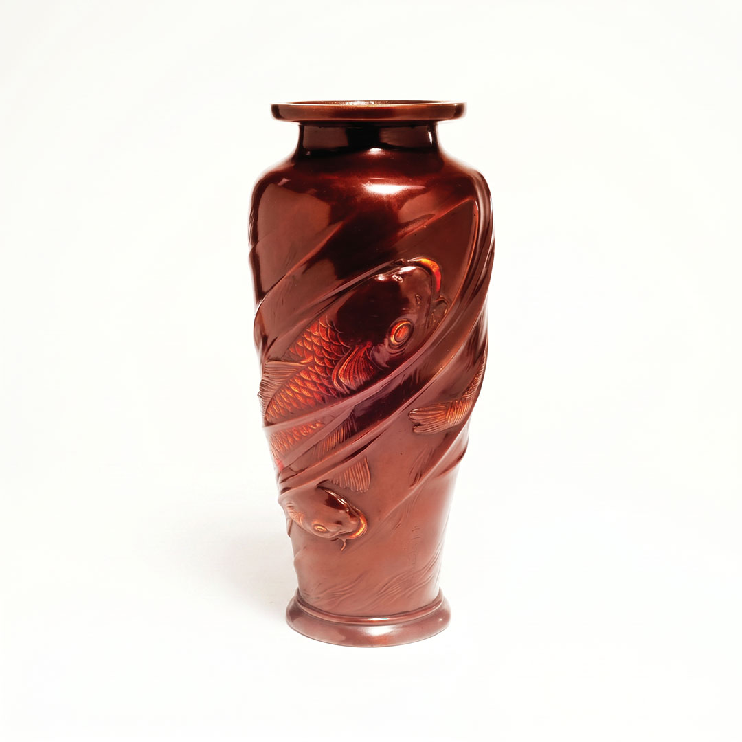 Japanese 20th century patinated bronze baluster vase with deep oxblood patina and high-relief koi carp swimming through stylised water currents, 11¼ inches
