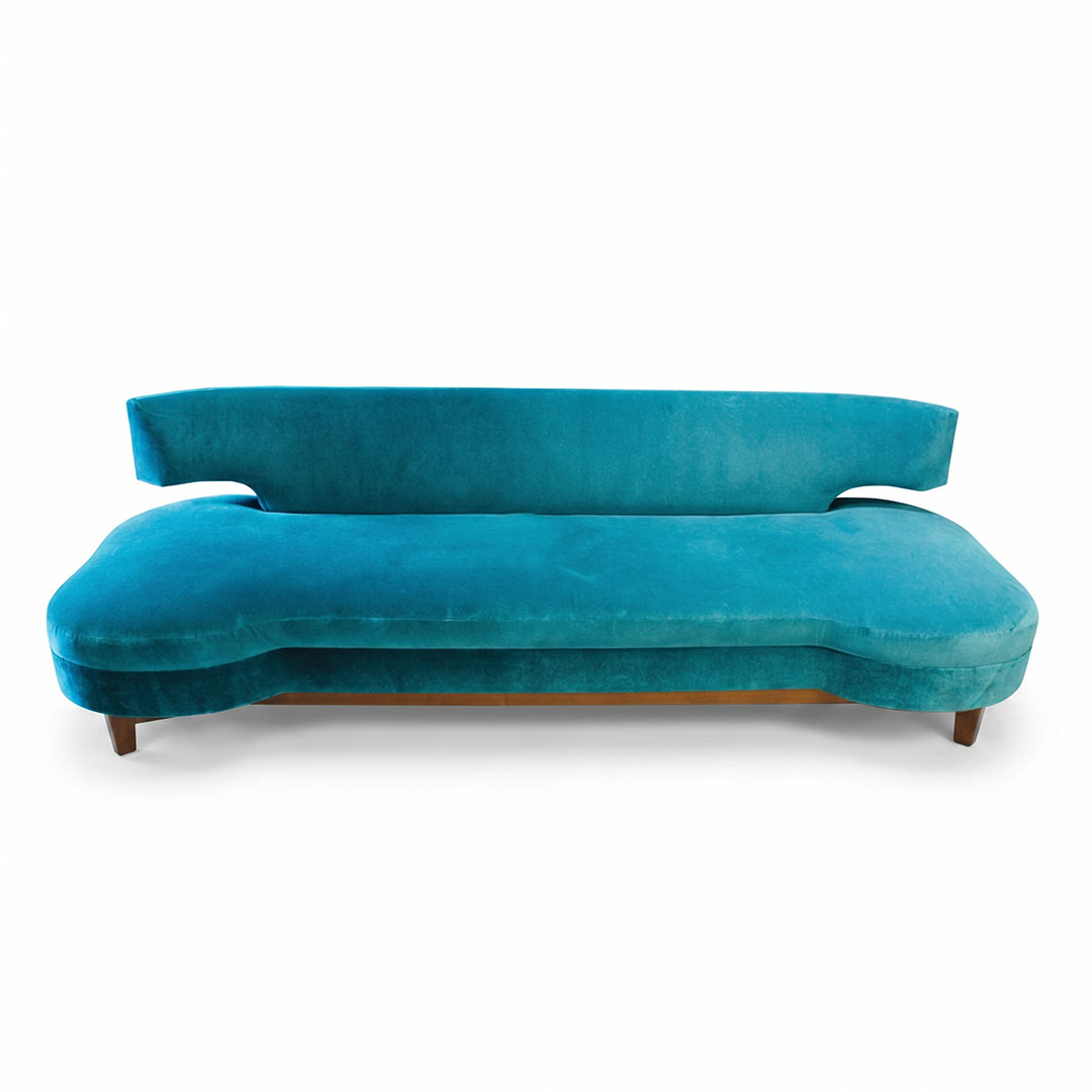 Monumental contemporary biomorphic turquoise velvet sofa with floating backrest, organic asymmetric seat, and tapered walnut legs, in the manner of Adrian Pearsall, over nine feet long