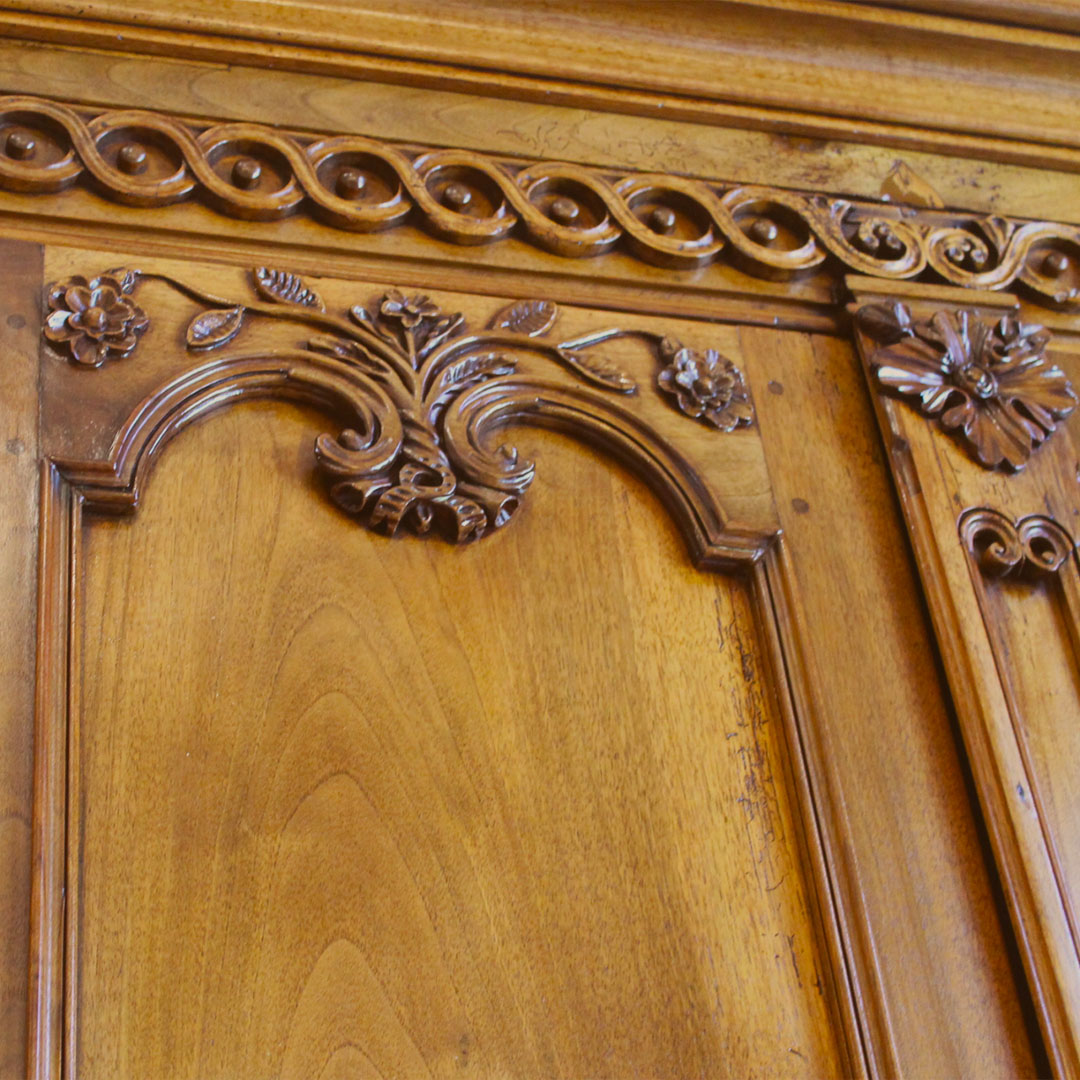 Oversized French Walnut Bureau close up of top of doors and carvings in high relief