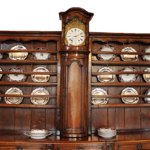 center long clock on antique buffet