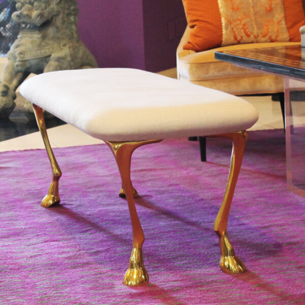 white bench with gold equine legs