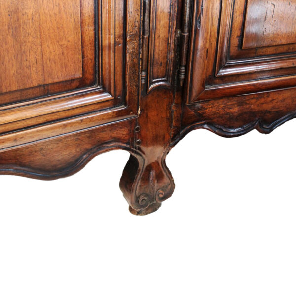 carved walnut feet on buffet - close up