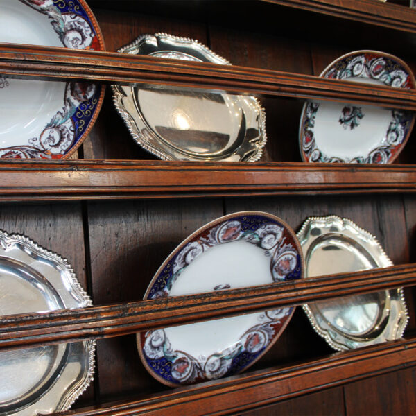 close up of dish racks on antique buffet