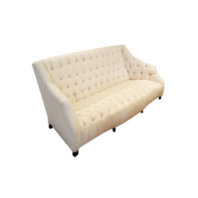 White tufted sofa designed by Coco Chanel