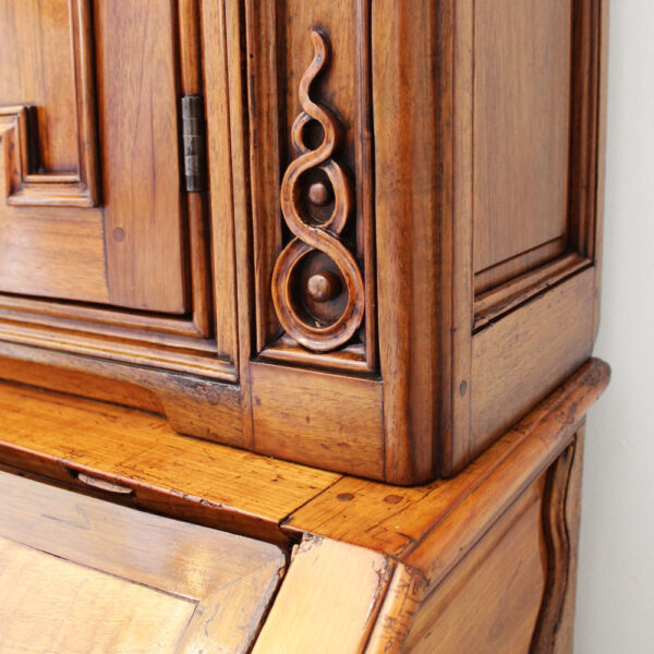 close up carved detail of desk